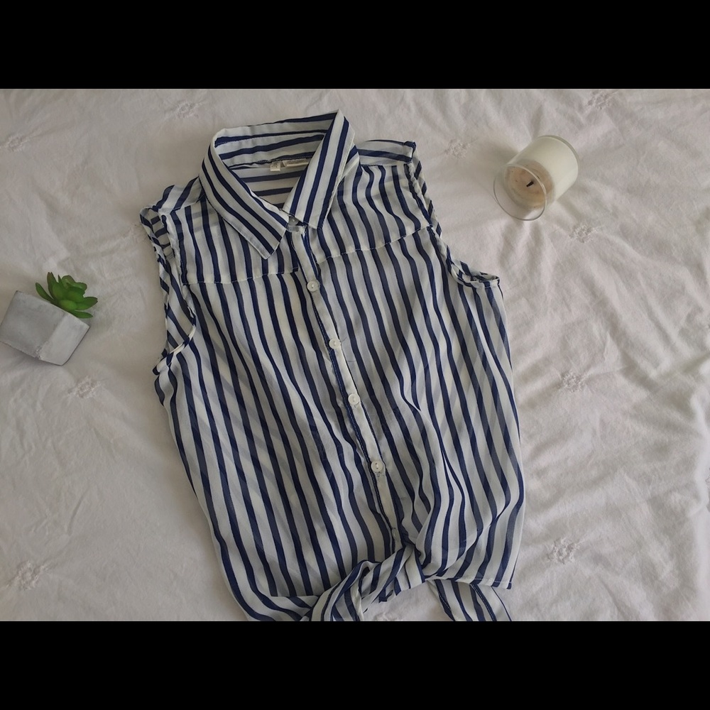 100% polyester navy blue striped blouse.